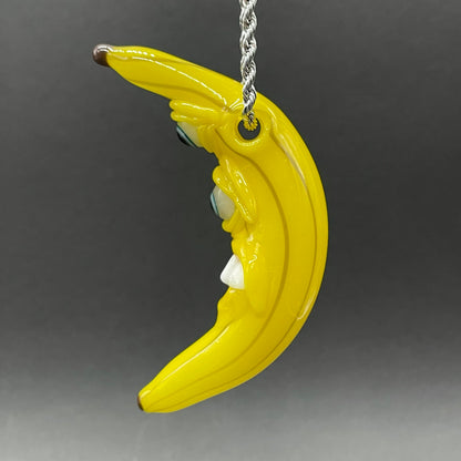 Grinning glass banana pendant
