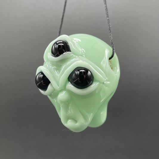 Time manipulating three eye glass alien pendant