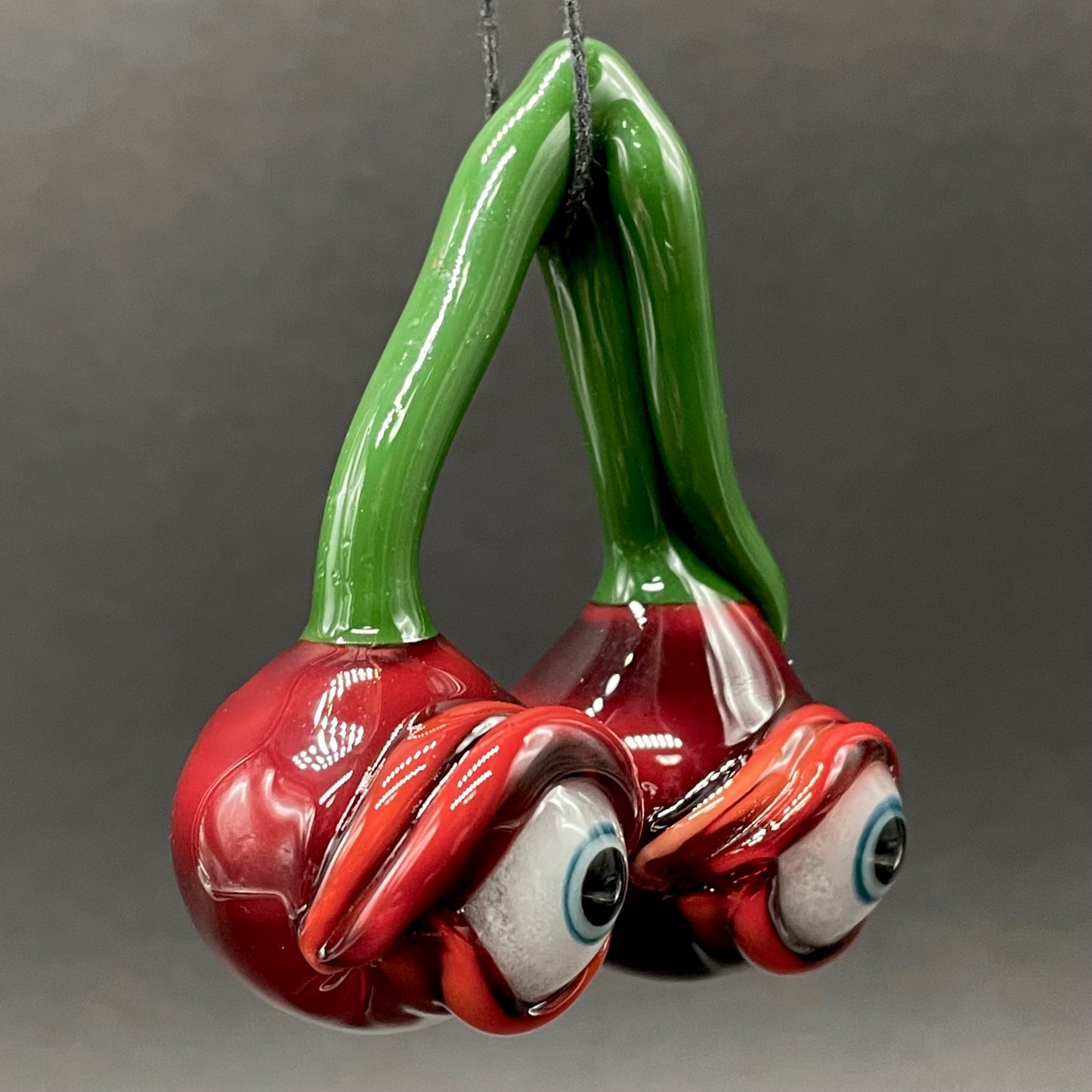 Cherry flavored glass eye pendant