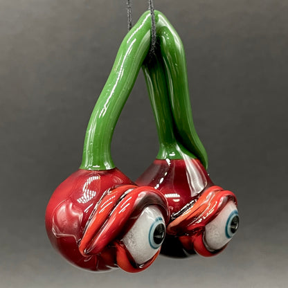 Cherry flavored glass eye pendant