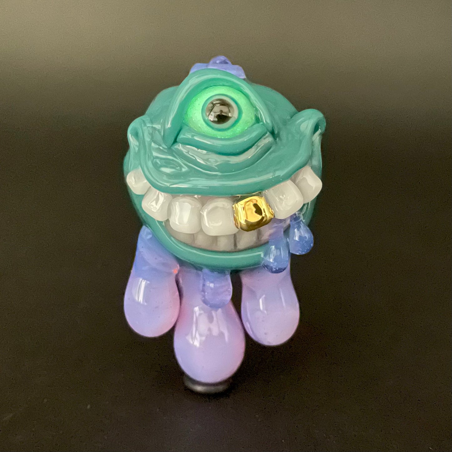 Dripping with sarcasm - Agua azule Drippy, grinning pendant