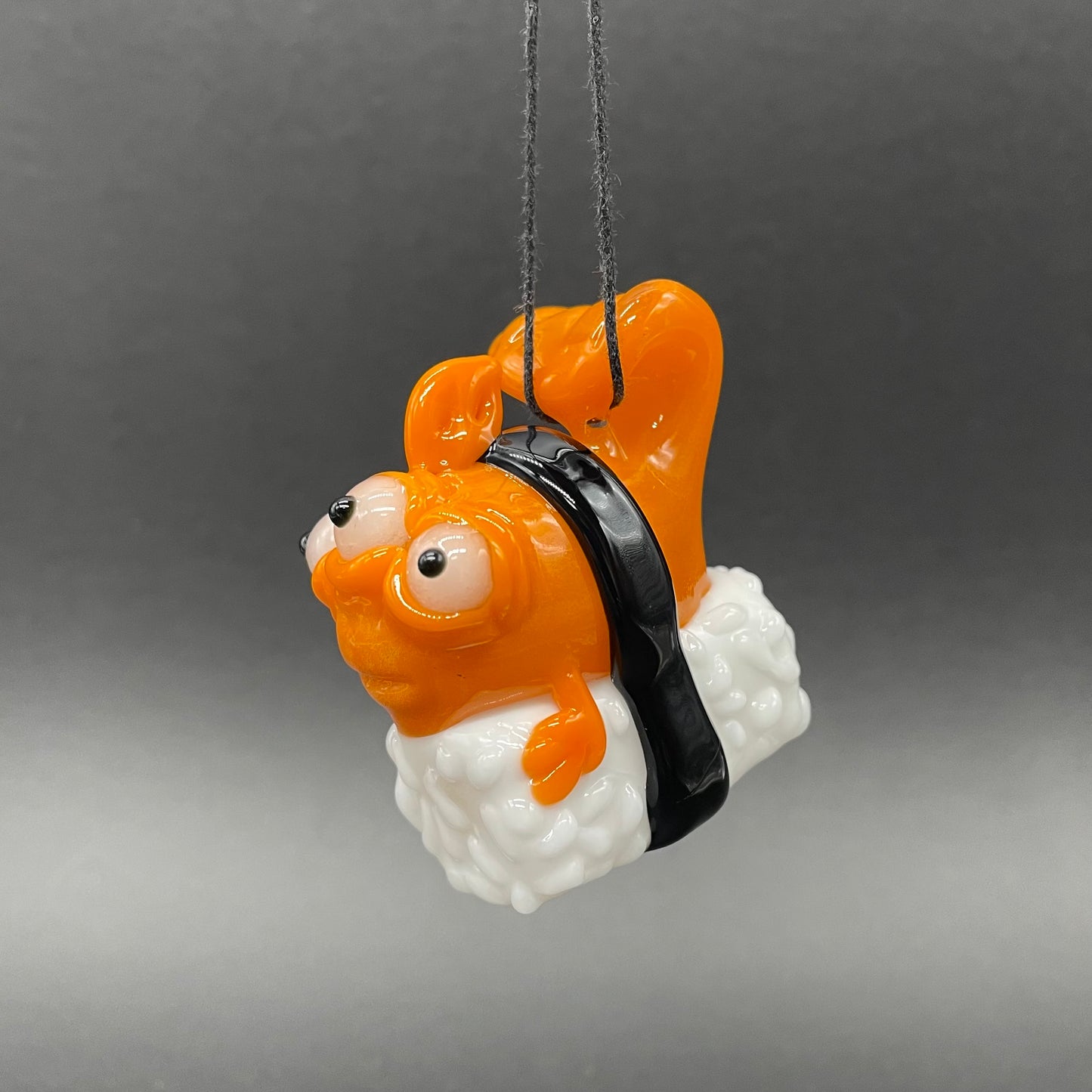 Mutant three eyed fish sushi glass pendant