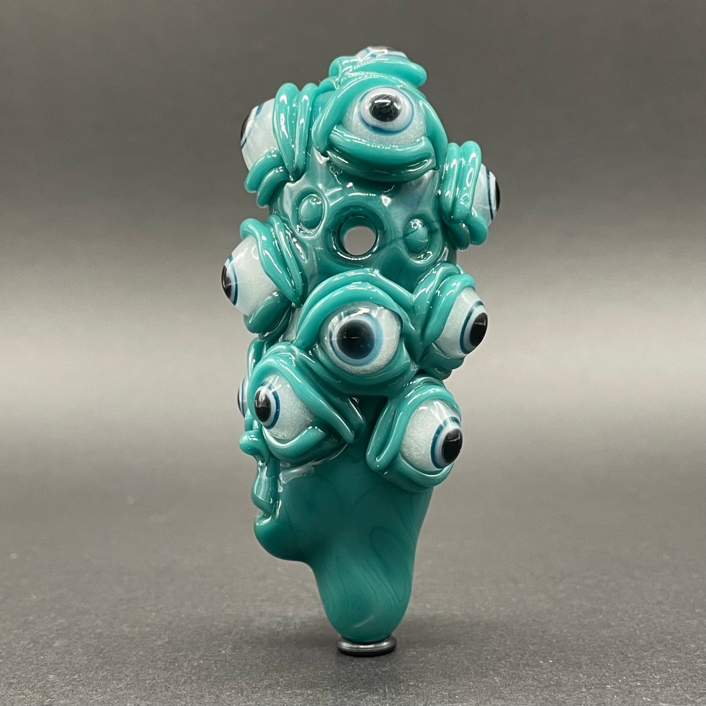 The Never-Blinking One glass effigy pendant