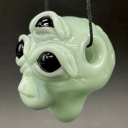 Time manipulating three eye glass alien pendant