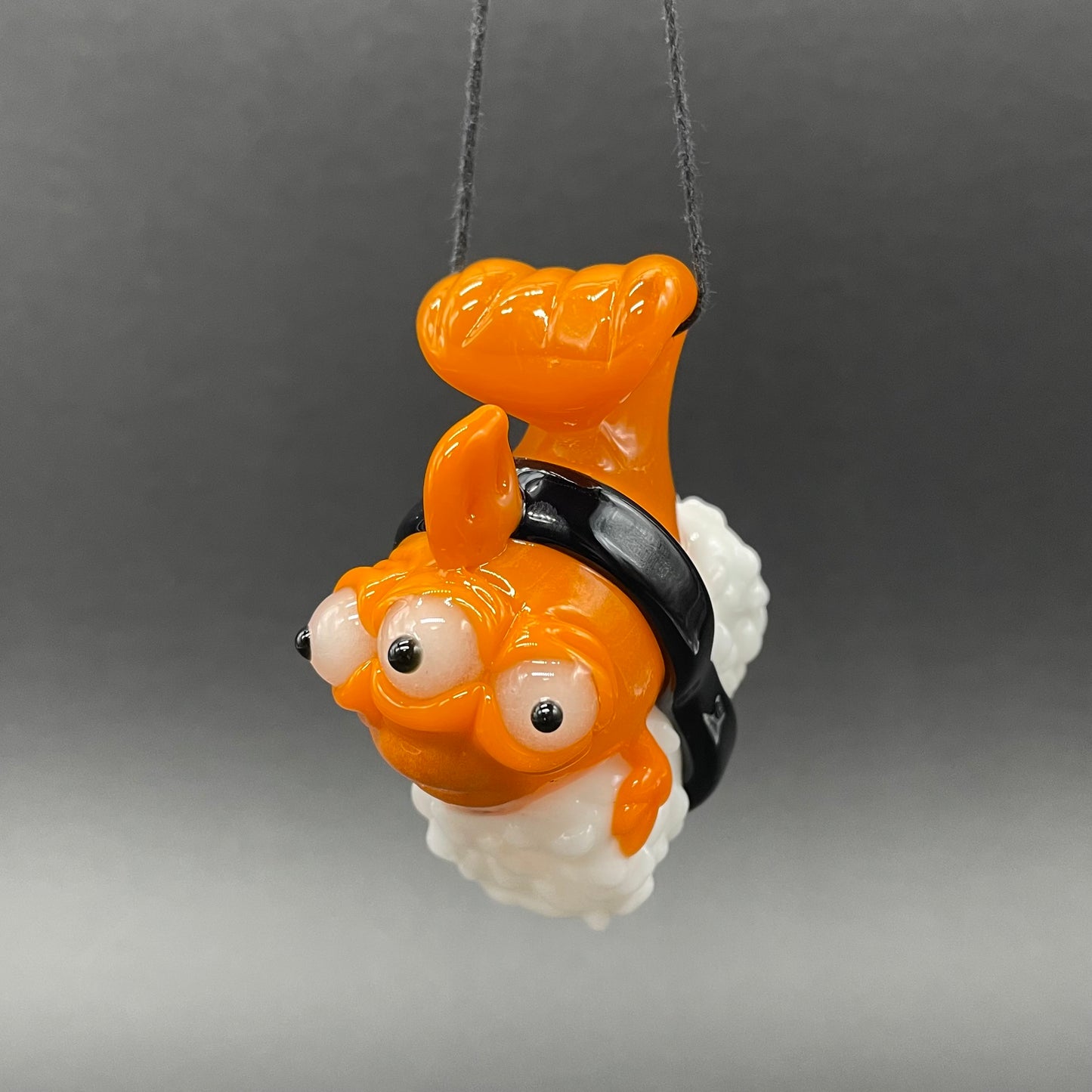 Mutant three eyed fish sushi glass pendant