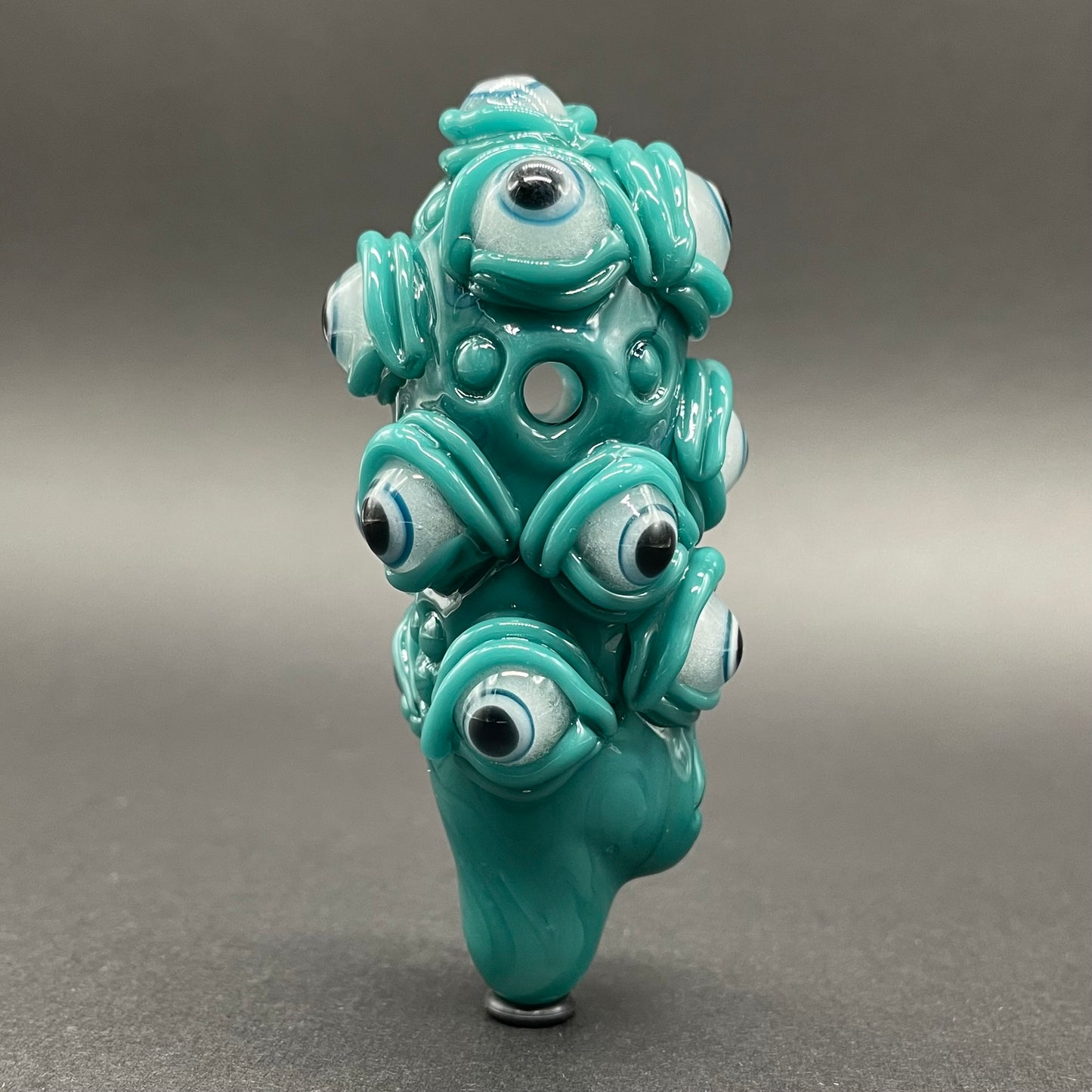 The Never-Blinking One glass effigy pendant