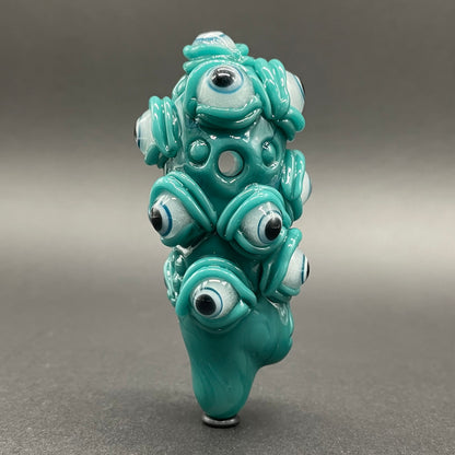 The Never-Blinking One glass effigy pendant