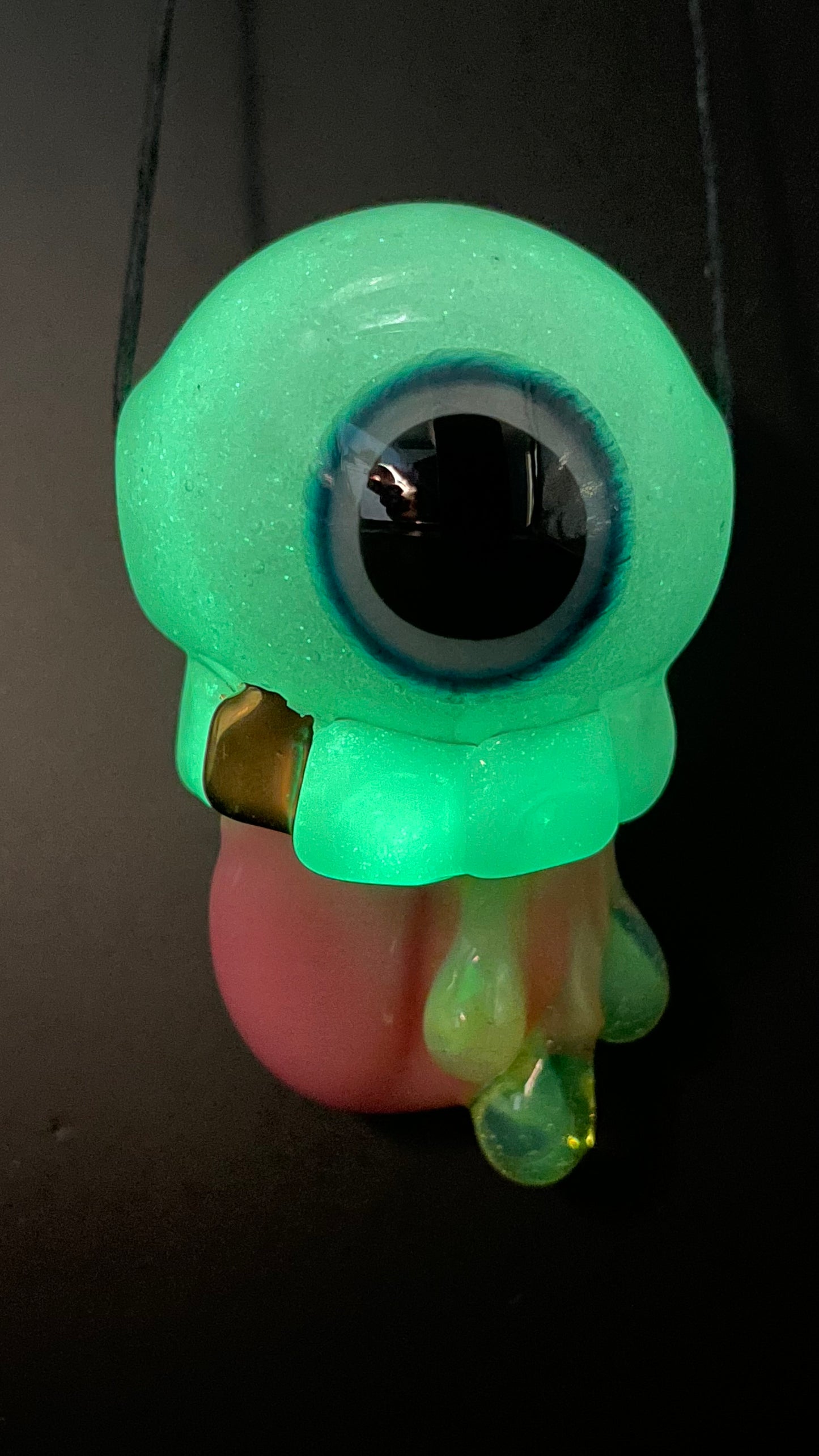 Glow in the dark eye pendant
