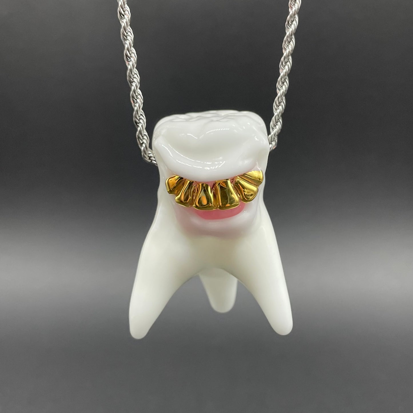 Tooth ache glass pendant