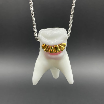 Tooth ache glass pendant