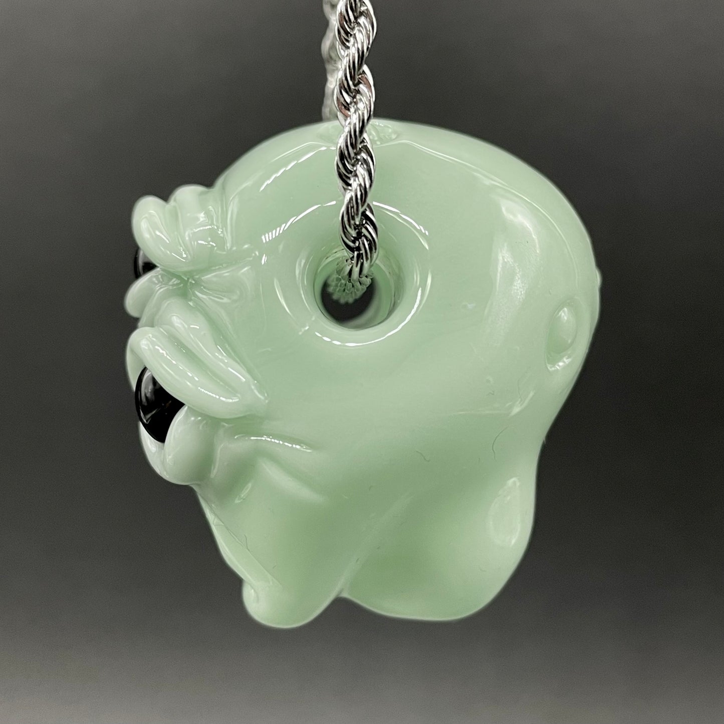 Time manipulating three eye glass alien pendant