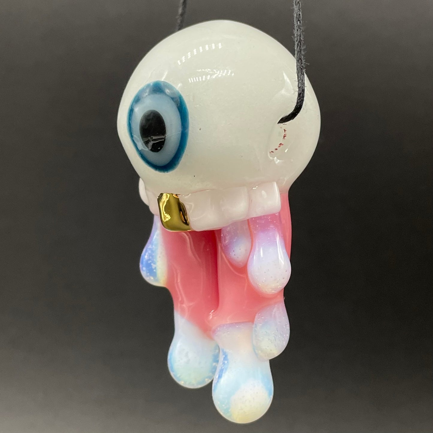 Glow in the dark eye pendant