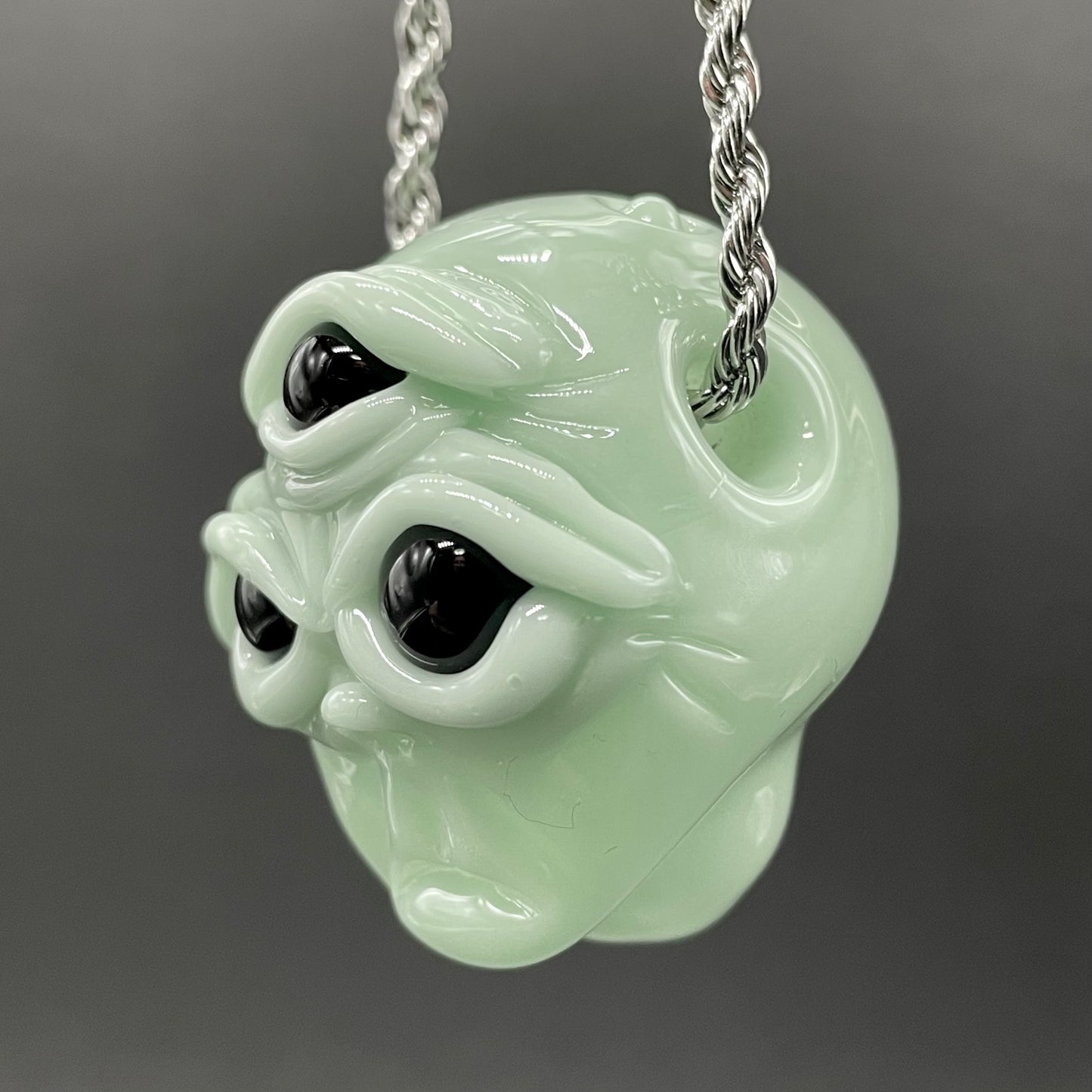Time manipulating three eye glass alien pendant