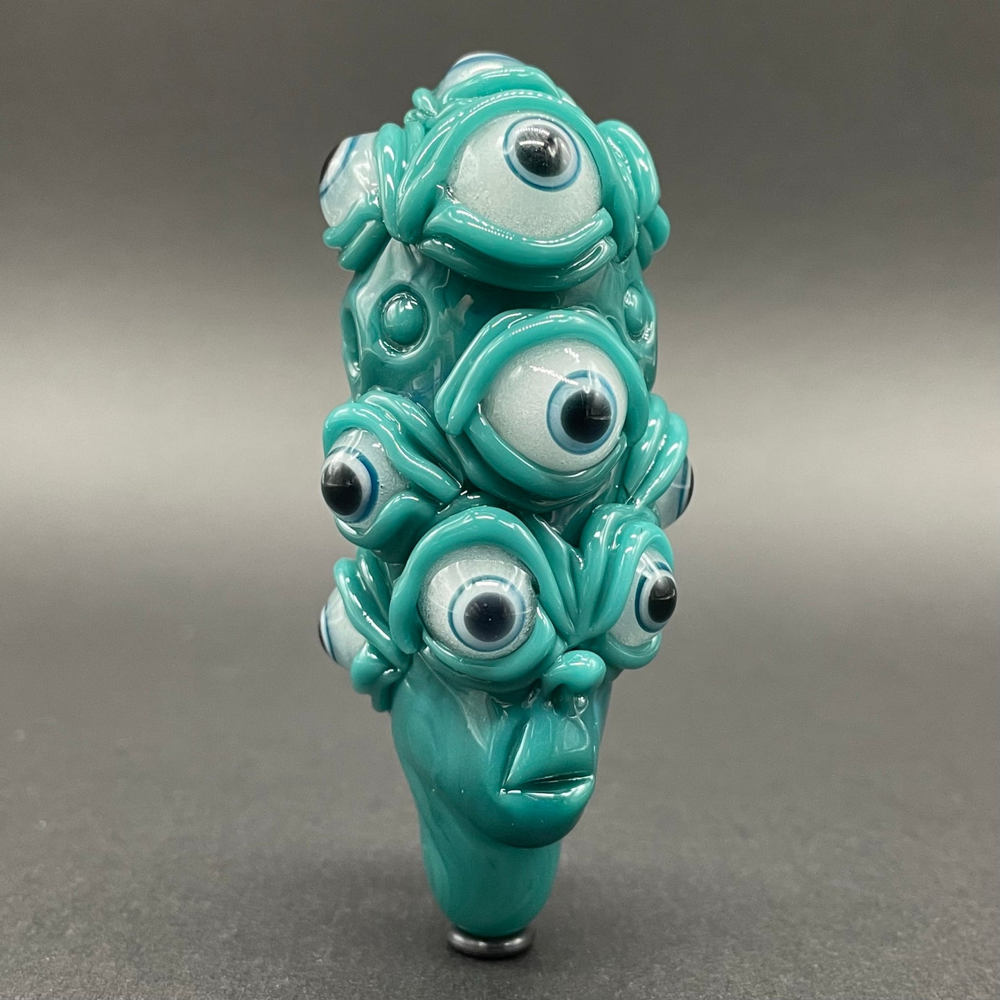 The Never-Blinking One glass effigy pendant