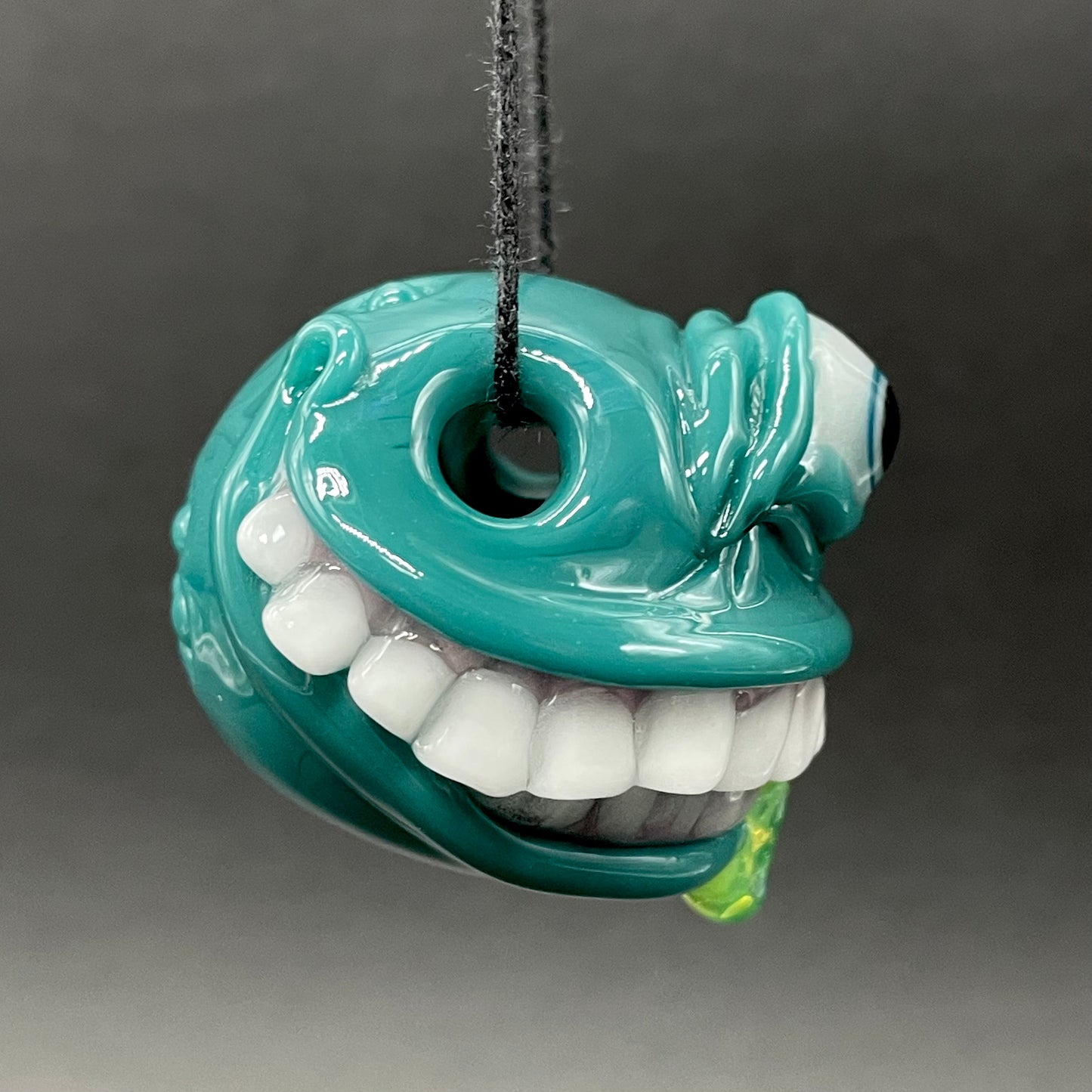 Grinning like a fool glass pendant