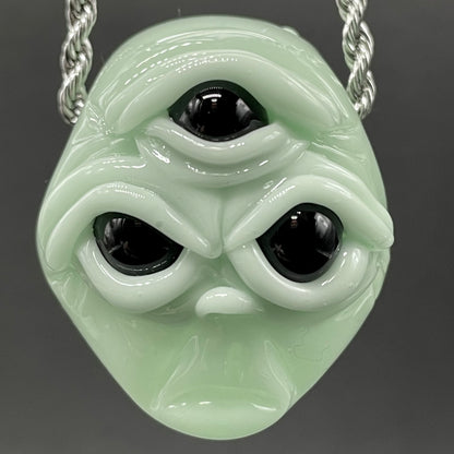 Time manipulating three eye glass alien pendant