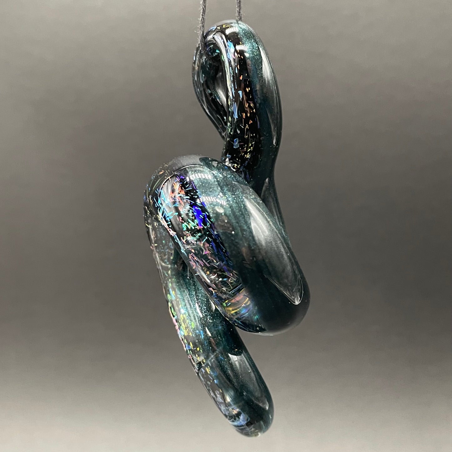 Dichroic sparkle snake pendant