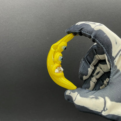 Grinning glass banana pendant