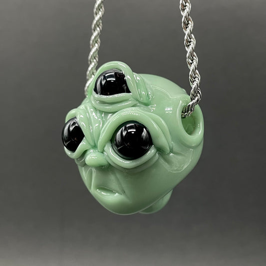 Time manipulating three eye glass alien pendant