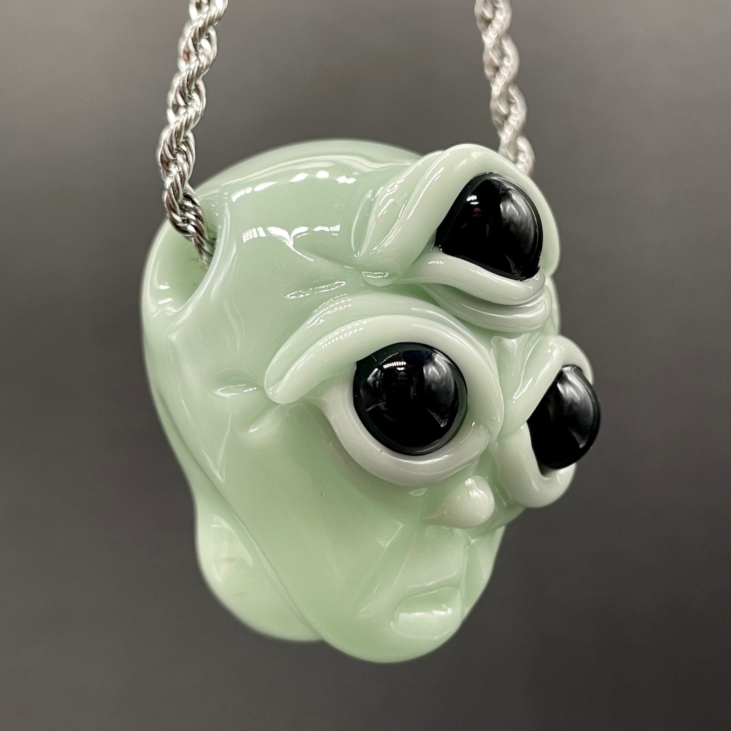 Time manipulating three eye glass alien pendant