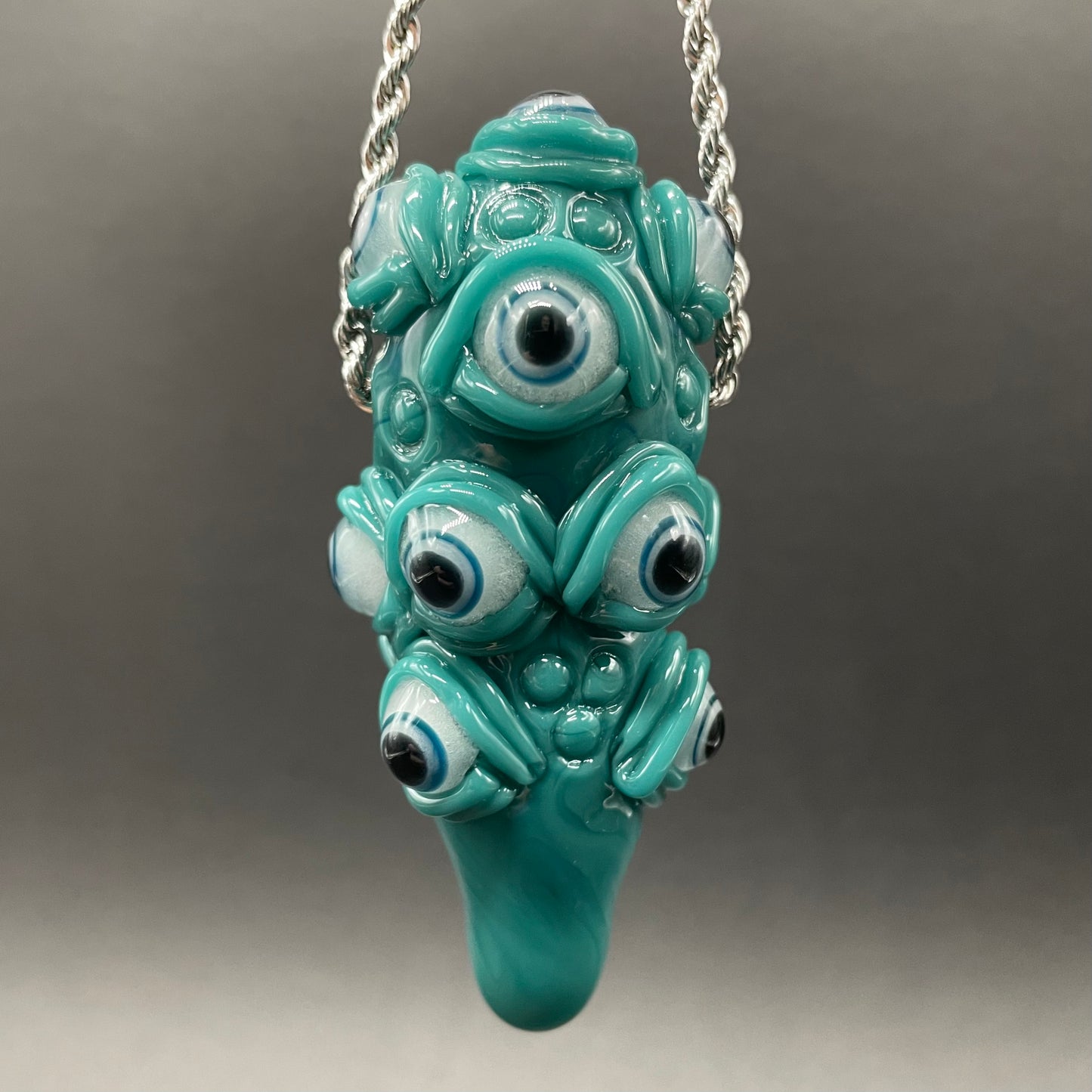 The Never-Blinking One glass effigy pendant