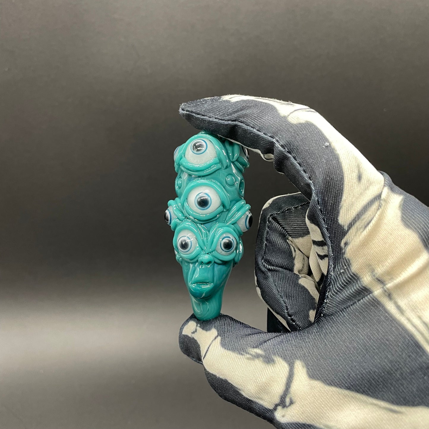 The Never-Blinking One glass effigy pendant