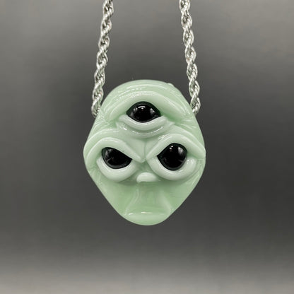Time manipulating three eye glass alien pendant