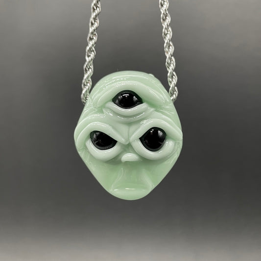 Time manipulating three eye glass alien pendant