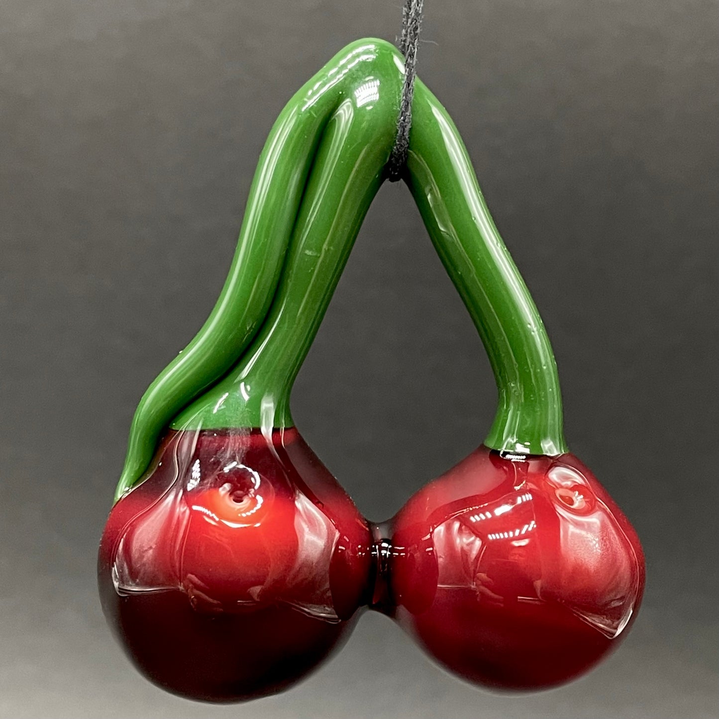 Cherry flavored glass eye pendant
