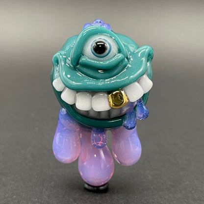 Dripping with sarcasm - Agua azule Drippy, grinning pendant