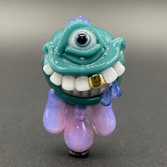 Dripping with sarcasm - Agua azule Drippy, grinning pendant