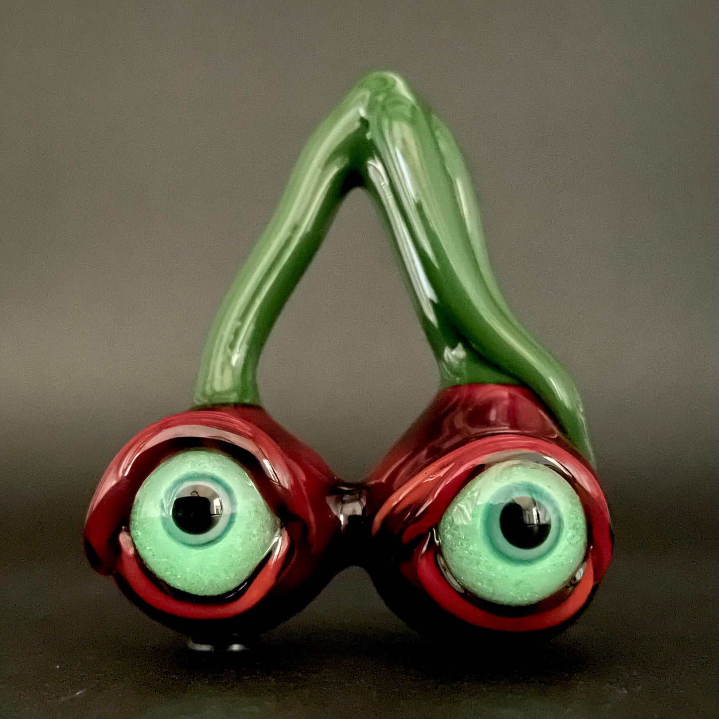 Cherry flavored glass eye pendant