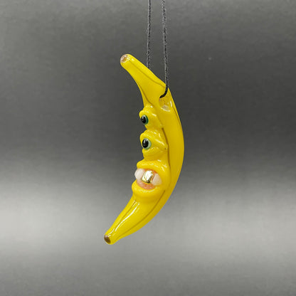 Grinning glass banana pendant