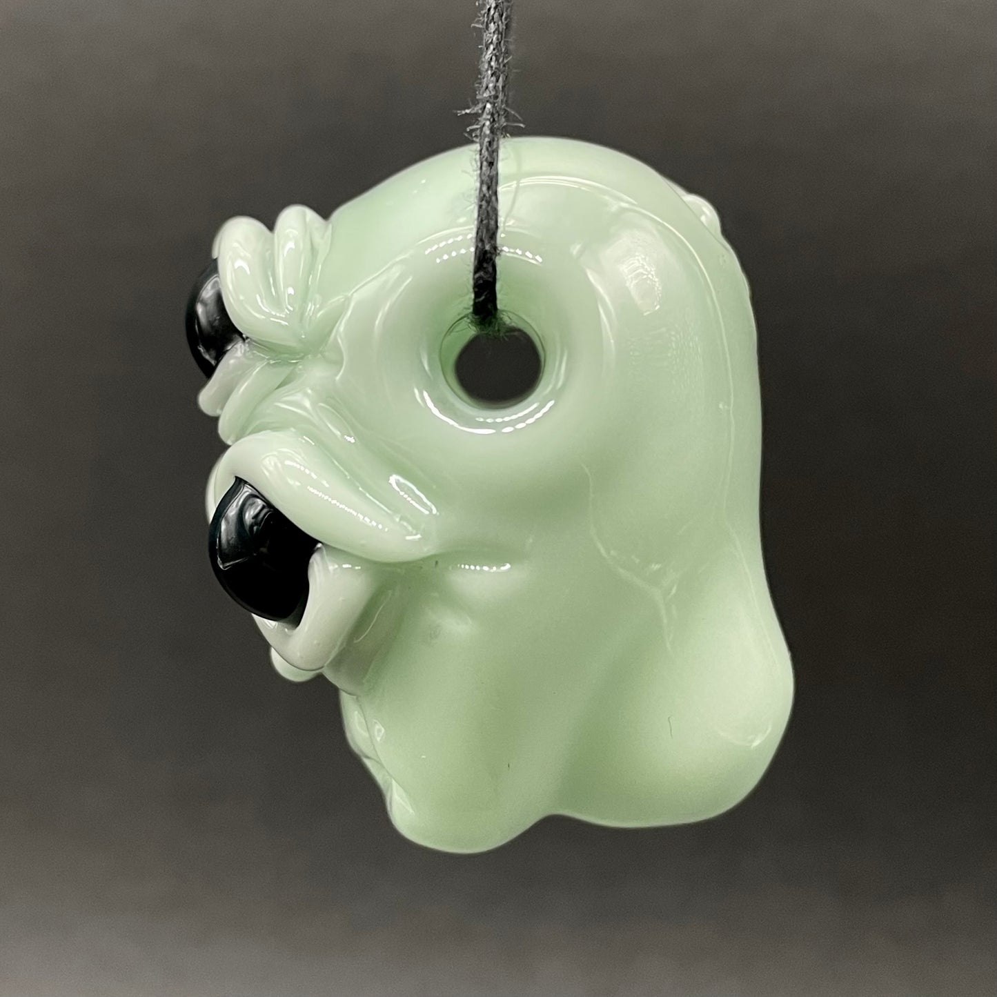 Time manipulating three eye glass alien pendant