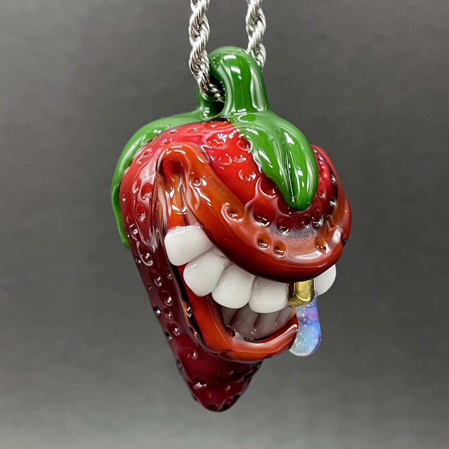 Toothy strawberry pendant