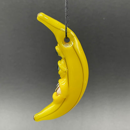 Grinning glass banana pendant