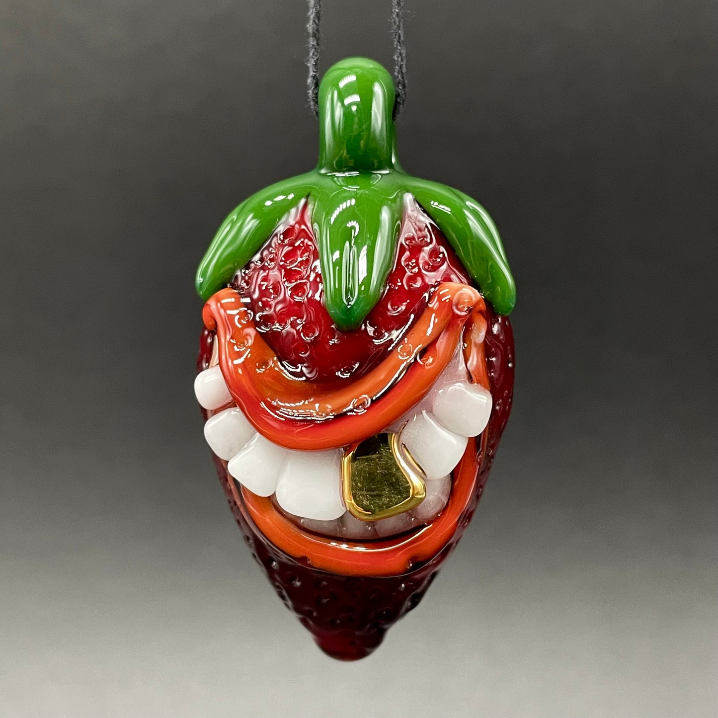 Toothy strawberry pendant