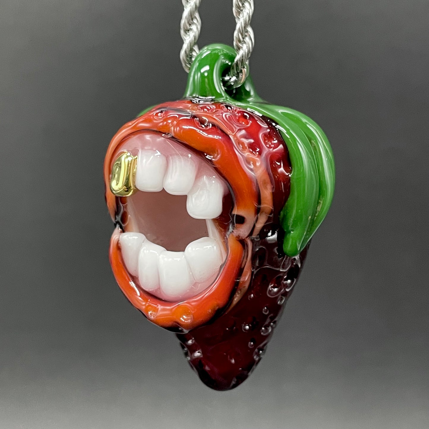 Screaming strawberry glass pendant