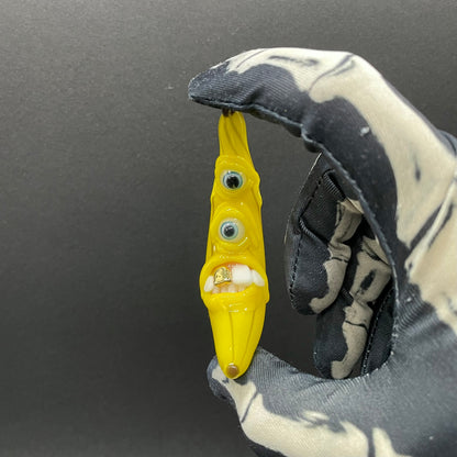 Grinning glass banana pendant