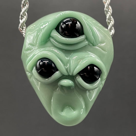 Time manipulating three eye glass alien pendant