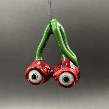 Cherry flavored glass eye pendant