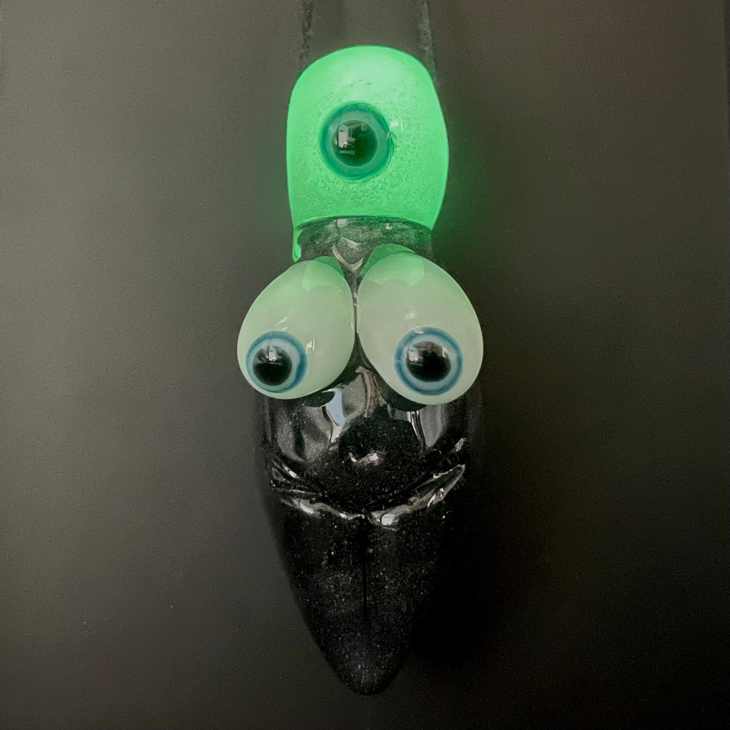 Black light reactive fertility pendant