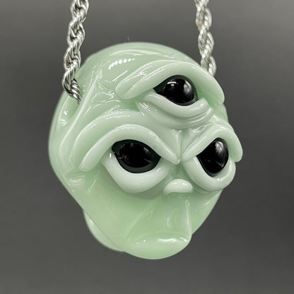 Time manipulating three eye glass alien pendant