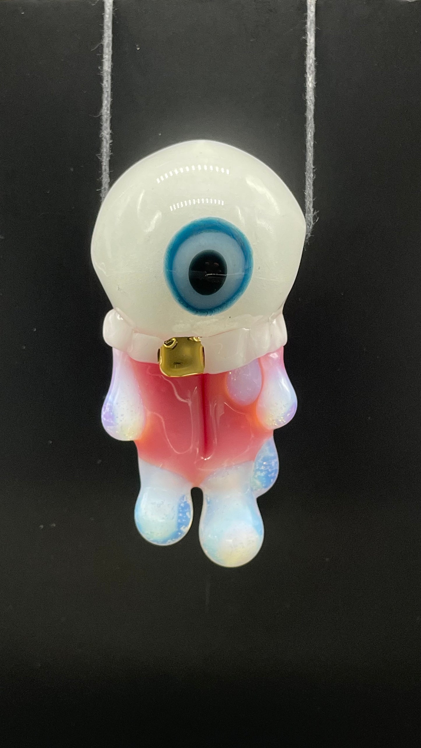 Glow in the dark eye pendant