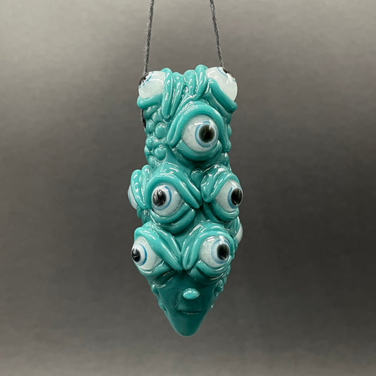 The Never-Blinking One glass effigy pendant