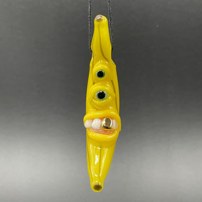 Grinning glass banana pendant