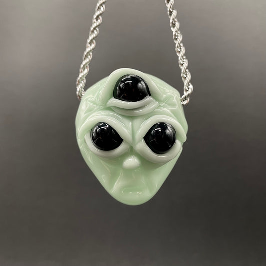 Time manipulating three eye glass alien pendant