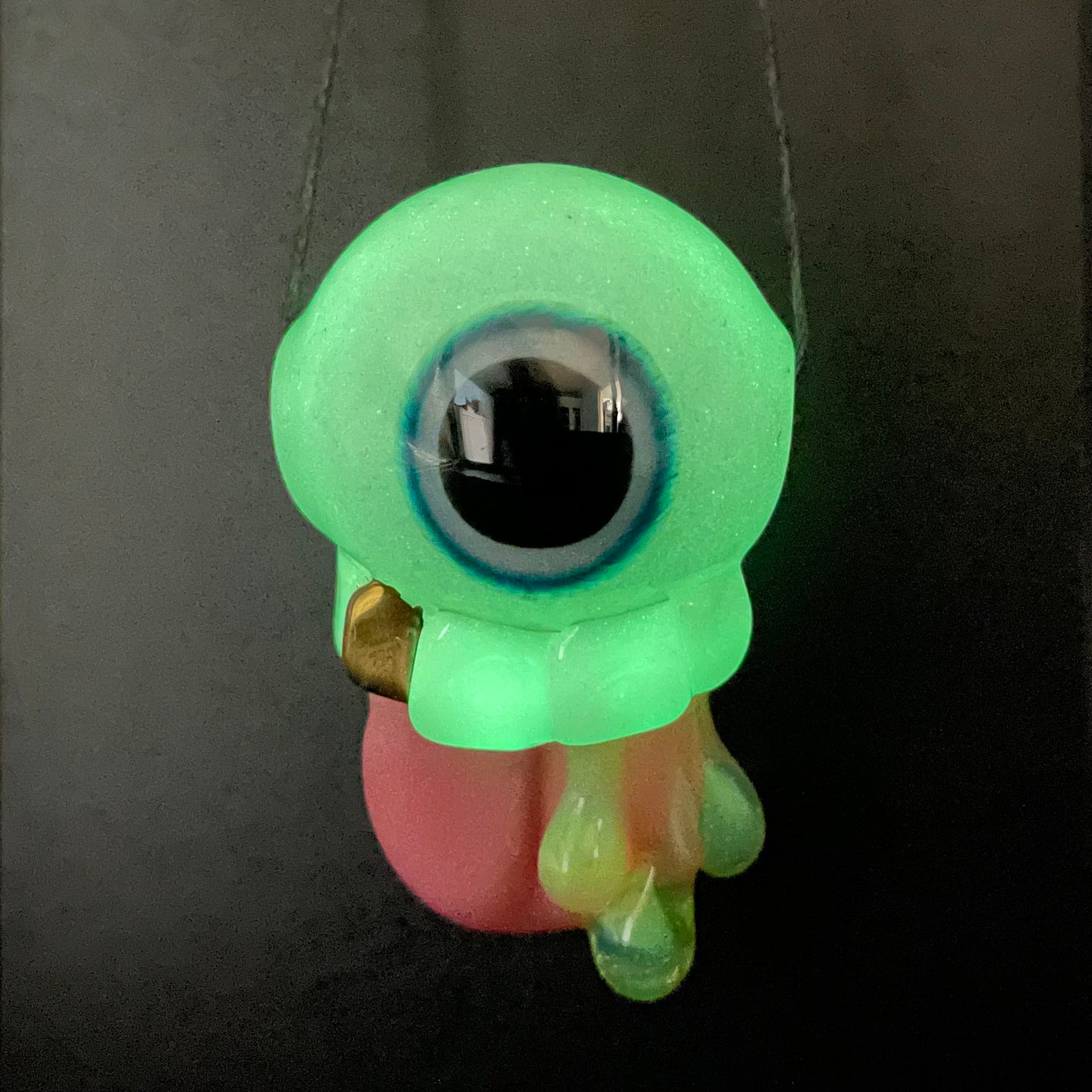 Glow in the dark eye pendant