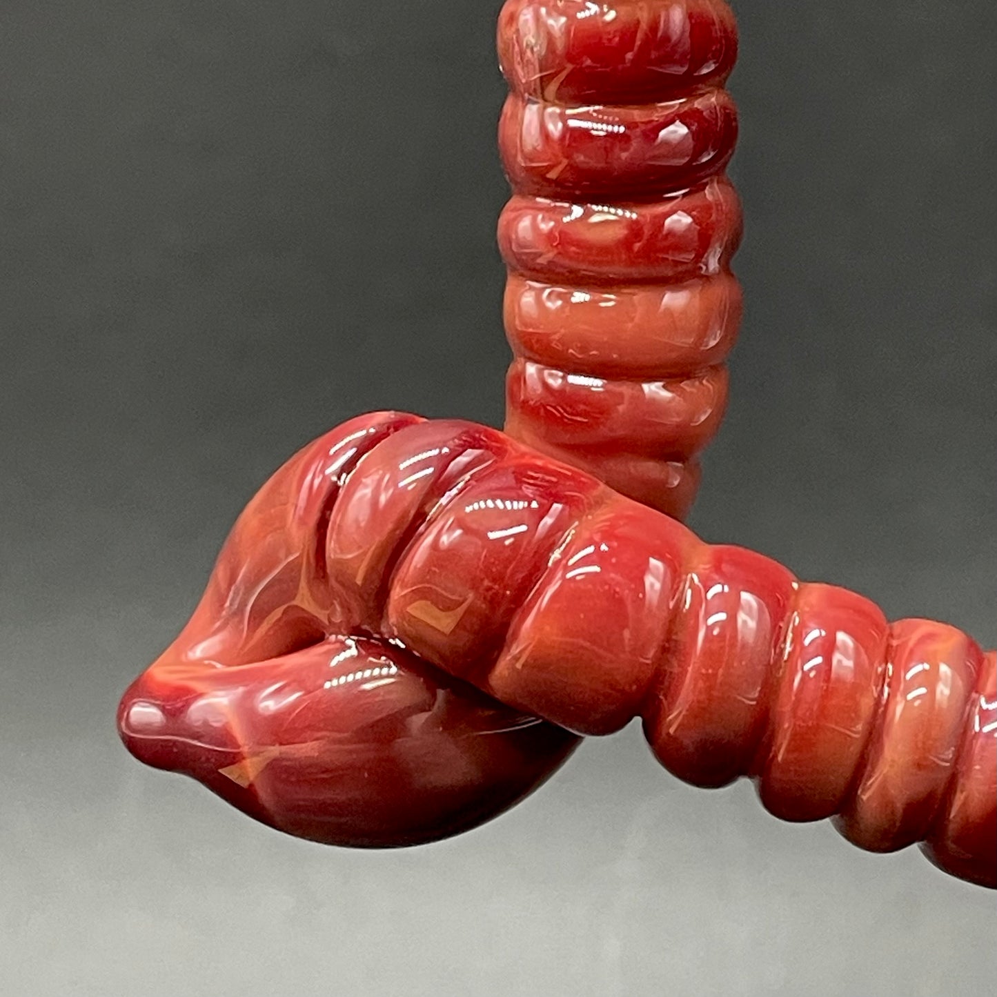 Large glass earthworm heart shaped pendant by Leviathan Glass - artisan detail