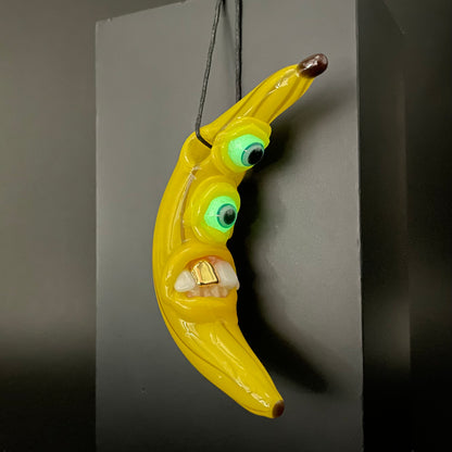 Grinning glass banana pendant
